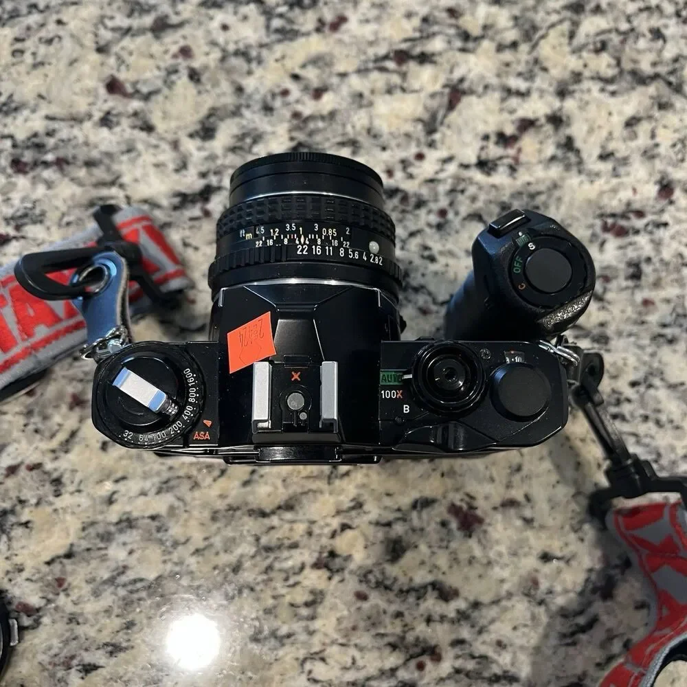 Asahi Pentax MV-1 35mm SLR Film Camera With lens, Mount, Strap and documents